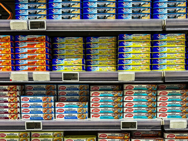 Brightly packaged canned seafood products displayed in a vibrant supermarket aisle, capturing everyday grocery shopping in France, Le Touquet, Hauts-de-France, France