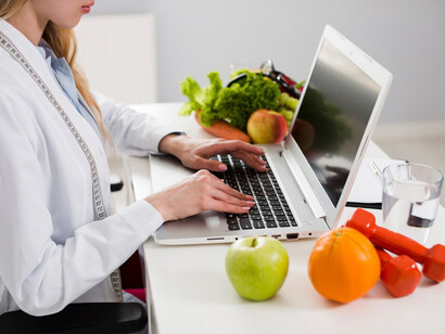 Personalized nutrition concept featuring a female scientist analyzing healthy food options