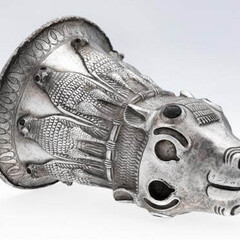 Silver calf’s head drinking vessel with lapis lazuli horn buds. Assyria, northern Mesopotamia. 7th century BCE. 19 x 13.3 cm. The al-Sabah Collection, Dar al-Athar al-Islamiyyah, Kuwait.