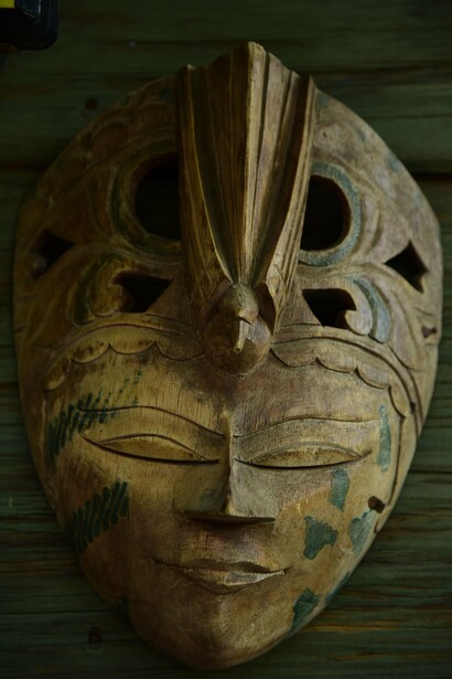 A hand-carved African ceremonial mask, representing the spiritual and cultural traditions passed down through generations