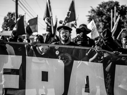 Protesters in Tulsa, Oklahoma, United States, display a banner during a march calling for Caribbean reparations