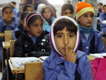 Children inside a classroom at Za'atri refugee camp. UN PhotoMark Garten