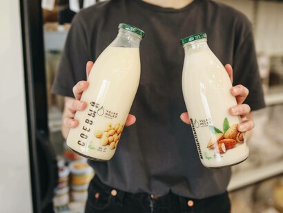 Macadamia milk (left) is made of water and macadamia nuts and has a rich, creamy taste while almond milk is made with whole almonds and wate
