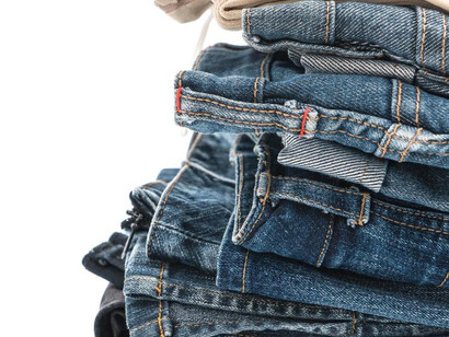 A perfect row of jeans, highlighting their versatile and timeless appeal