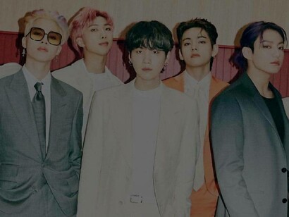 BTS with idol rappers RM (pink hair) and Suga (middle) 
