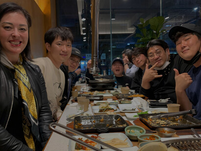 The documentary team shares a moment over dinner, fostering collaboration and camaraderie during the filmmaking process