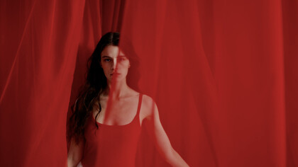 Embodying confidence and allure, she stands at the intersection of shame and self-acceptance, challenging societal norms