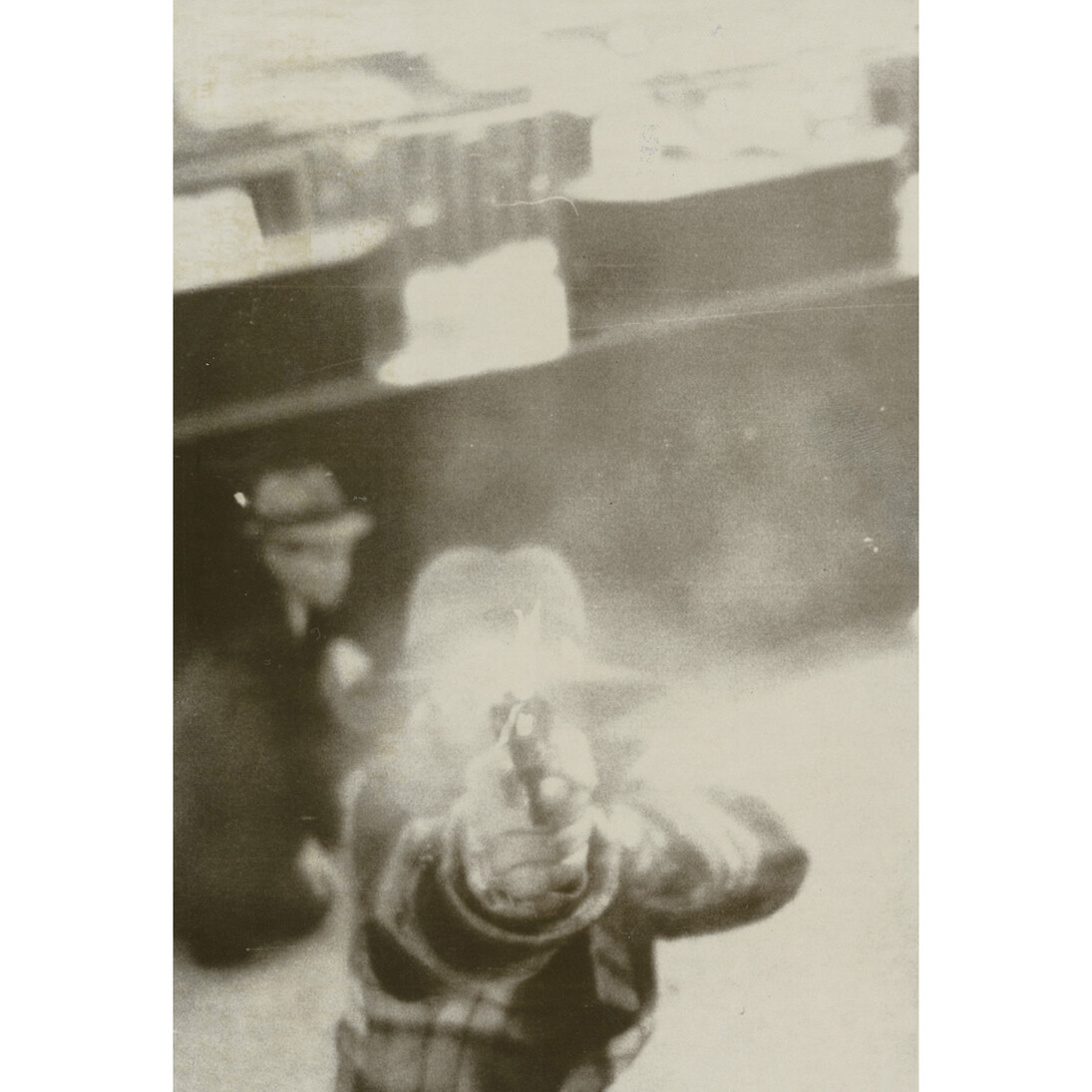 Photographer Unknown, [Bank robber aiming at security camera], 1973,gelatin-silver print, 7-1/4 x 5 inches