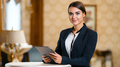 A woman working in the hospitality and tourism sector overseas