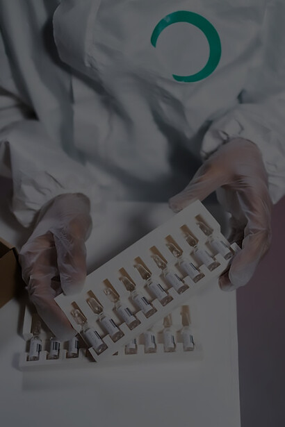 A dedicated healthcare worker carefully unboxes a shipment of vaccines, ready to play a vital role in the distribution of these life-saving doses