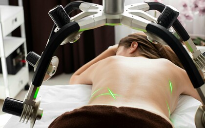 A patient receiving a non-invasive laser-assisted procedure, reflecting the growing preference for treatments with minimal downtime
