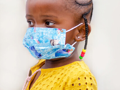 Masked child: by 11th March, the WHO had officially defined covid-19 as a pandemic