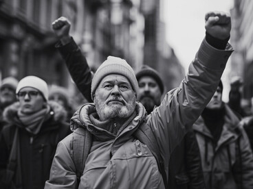Surrounded by fellow demonstrators, the man’s raised fist signifies the desire for change, as people push for a balance between personal freedom and societal responsibility