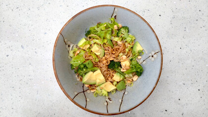 A bowl of avocado and wasabi noodles