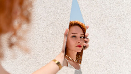 A women facing herself in fragments, identity is not reclaimed all at one, but rediscovered piece by piece in unexpected places