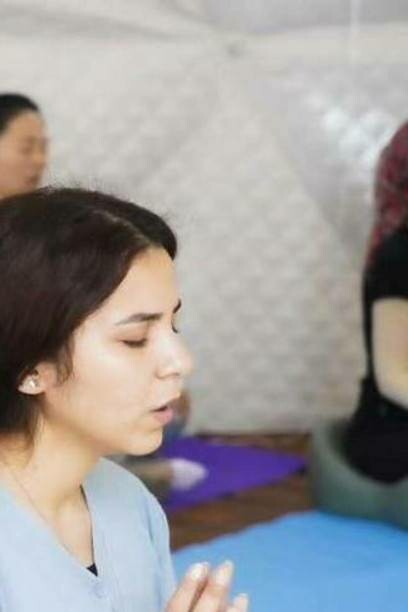 Woman concentrates while practicing meditation