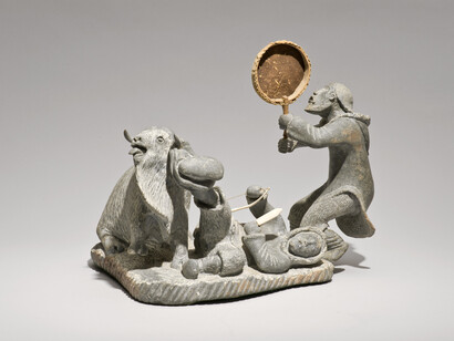 Lukie Airut (Igloolik, b. 1942) Drum Dancer and Man with Boot Caught on Muskox Horn, 1982. Stone, antler. Collection of the Winnipeg Art Gallery. Gift from the Collection of George and Tannis Richardson, 2011-55Photo: Ernest Mayer, Winnipeg Art Gallery