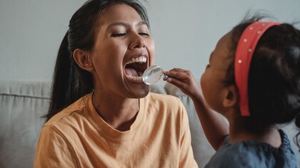 Parent and child practice going to the dentist