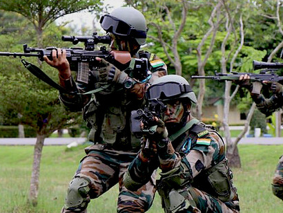 An Indian Army soldier carries an INSAS rifle during the 2018 Maitree exercise