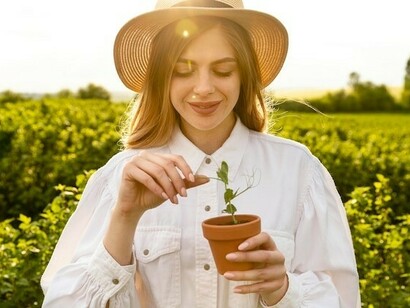 Sustainable farming in action: A woman planting vegetables, promoting eco-friendly agricultural practices
