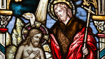 Stained glass artwork depicting Jesus Christ, part of the ornate church décor