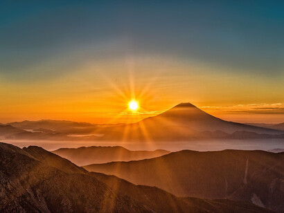 The sun rising over the mountains