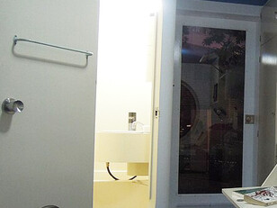A capsule from the Nakagin Capsule Tower displayed near Roppongi Hills Mori Tower in Tokyo, Japan, showing its compact interior design