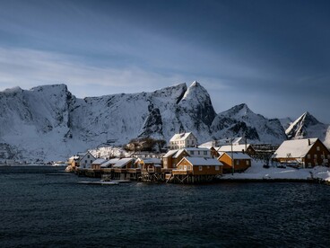 Coastal buildings in Lofoten Islands, Norway, reflecting innovative material choices that improve thermal efficiency in freezing climates