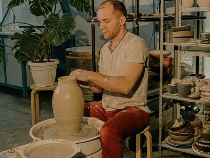 An artist in deep concentration mode as he moulds his latest creation