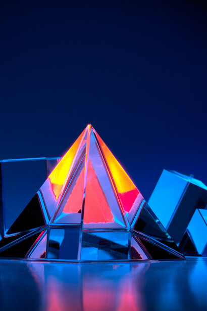 Different perspectives of one reality are depicted by light passing through this prism