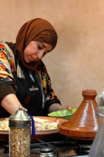 A Moroccan woman expertly prepares msemen, the traditional crepe that forms the flavorful base of the cherished Rfissa dish