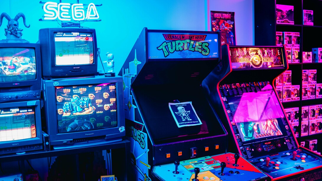 An old-school arcade with iconic Sega machines, representing the resurgence of retro gaming as a modern passion