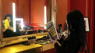 Kim reading Van's book "A bridge too far" photo by Andrea Hernandez Vega