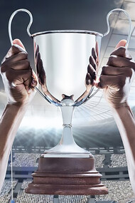 A triumphant hand grasping the UEFA Euro 2024 championship cup in victory, symbolizing the essence of champions
