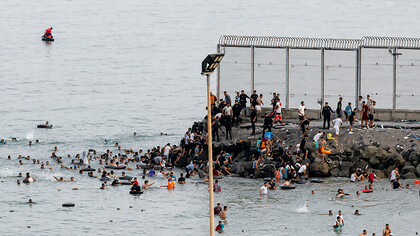 An estimated 60,000 people crossed from Morocco into Ceuta, overwhelming local authorities and triggering a humanitarian and border security crisis