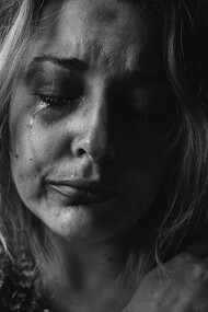 A woman in tears and going through a depression