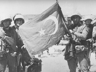 Turkish soldiers holding Turkey's flag represents patriotism, and military strength