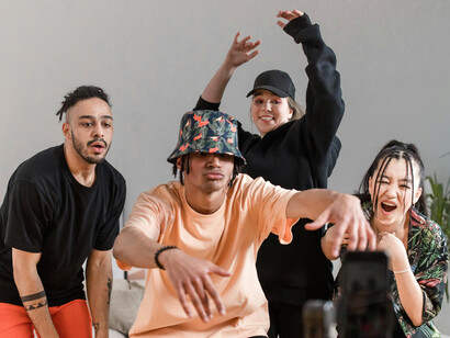 A group of people dancing together while recording a video to go viral