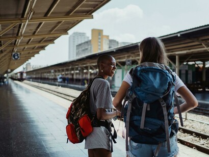 Close friends and travel companions, two young women laugh together during their student exchange journey