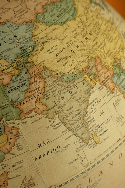 A vintage globe showing the continents of South Asia and Europe