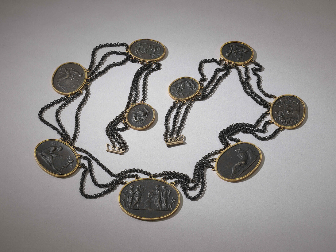 Necklace in cast-iron with nine 'cameos' in gold collet settings, linked by festoons of fine iron chain, Germany, 1805 © The Trustees of the British Museum