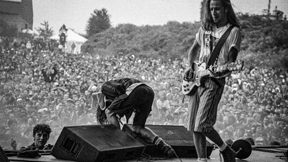 Pearl Jam's raw energy on stage at the 1992 Pinkpop Festival in Landgraaf, Netherlands, perfectly encapsulated the rebellious spirit of grunge, where torn jeans, flannel shirts, and unkempt hair became symbols of anti-fashion and individuality