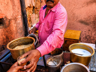 Indian chai vendor serving traditional tea at a roadside stall