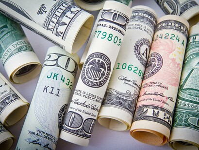 Dollars. Bribes being payed under the watch