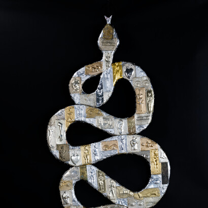 Christina Anid, Snake (detail), Metal Votive plaques on wood and resin. Courtesy of the artist and The Blender Gallery