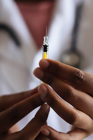 Doctor holding the injection
