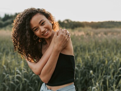 A woman, who is happy, in a field