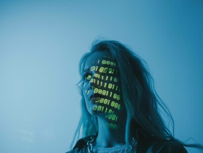 Woman in blue screen with code