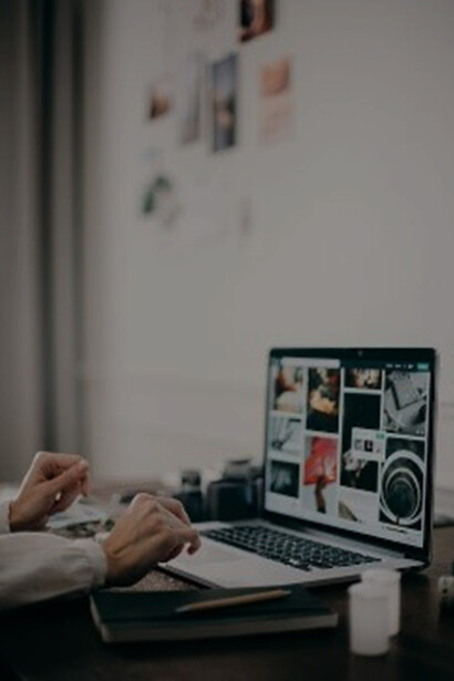 A person engrossed in their work on a notebook computer