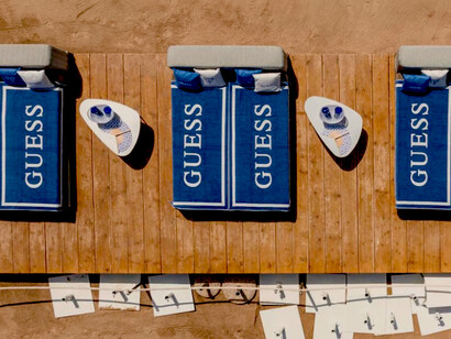 Phi Beach Club in Sardinia, in collaboration with Guess